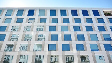 Modern office building with reflection in windows of building. New office building in the city...