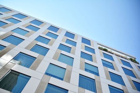 Modern office building with reflection in windows of building. New office building in the city...