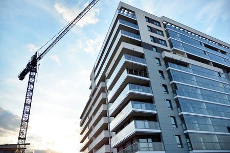 Contemporary residential building exterior in the daylight. Modern apartment buildings on a sunny...