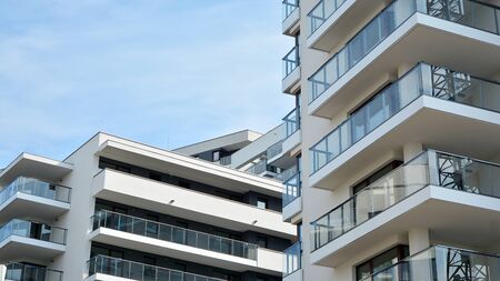 Contemporary residential building exterior in the daylight. Modern apartment buildings on a sunny...