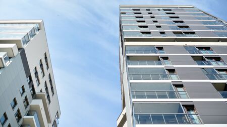 Contemporary residential building exterior in the daylight. Modern apartment buildings on a sunny...