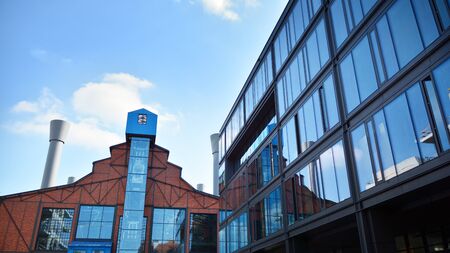 Revitalized red brick building and modern office building.