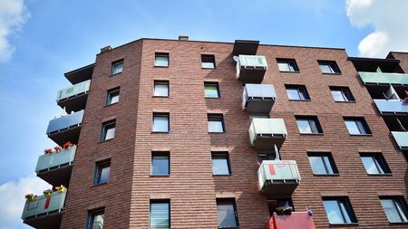 Multistory new modern apartment building. Stylish living block of flats.