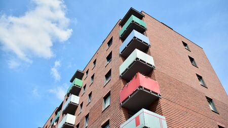 Multistory new modern apartment building. Stylish living block of flats.の写真素材