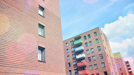 Modern apartment building detail, glass surface with sunlight