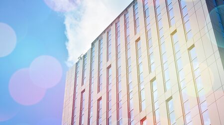 Modern office building detail, glass surface with sunlight