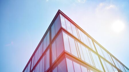 Modern office building detail, glass surface with sunlightの写真素材