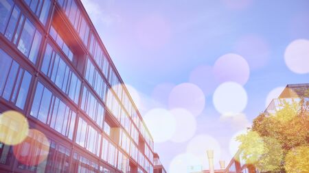 Modern office building detail, glass surface with sunlight