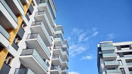 Multistory new modern apartment building. Stylish living block of flats.