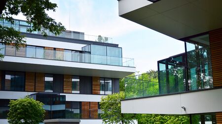 Multistory new modern apartment building. Stylish living block of flats.