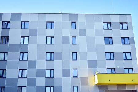 Modern apartment buildings on a sunny day with a blue sky. Facade of a modern apartment building
