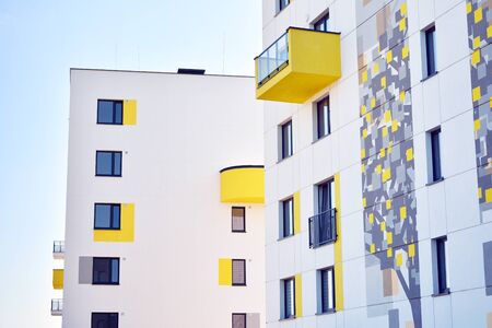 Modern apartment buildings on a sunny day with a blue sky. Facade of a modern apartment buildingの写真素材