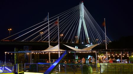 Warsaw, Poland. 25 August 2019. Vistulan Boulevards on the western side of the River Vistula in Warsaw in night. The promenade at the bank of the Vistula river in night.のeditorial素材