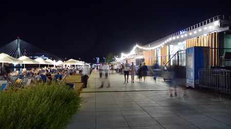 Warsaw, Poland. 25 August 2019. Vistulan Boulevards on the western side of the River Vistula in Warsaw in night. The promenade at the bank of the Vistula river in night.のeditorial素材