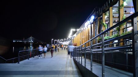 Warsaw, Poland. 25 August 2019. Vistulan Boulevards on the western side of the River Vistula in Warsaw in night. The promenade at the bank of the Vistula river in night.のeditorial素材