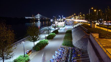 Warsaw, Poland. 25 August 2019. Vistulan Boulevards on the western side of the River Vistula in Warsaw in night. The promenade at the bank of the Vistula river in night.のeditorial素材