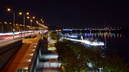 Warsaw, Poland. 25 August 2019. Vistulan Boulevards on the western side of the River Vistula in Warsaw in night. The promenade at the bank of the Vistula river in night.のeditorial素材