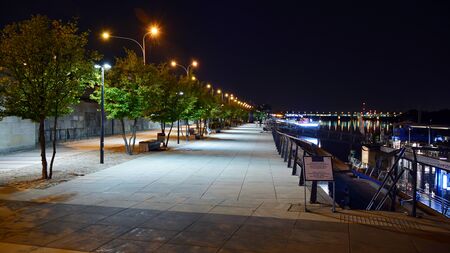 Warsaw, Poland. 25 August 2019. Vistulan Boulevards on the western side of the River Vistula in Warsaw in night. The promenade at the bank of the Vistula river in night.のeditorial素材