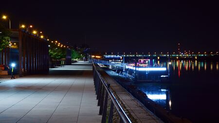 Warsaw, Poland. 25 August 2019. Vistulan Boulevards on the western side of the River Vistula in Warsaw in night. The promenade at the bank of the Vistula river in night.のeditorial素材