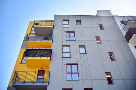 Modern apartment buildings on a sunny day with a blue sky. Facade of a modern apartment building
