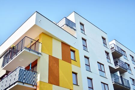 Modern apartment buildings on a sunny day with a blue sky. Facade of a modern apartment buildingの写真素材
