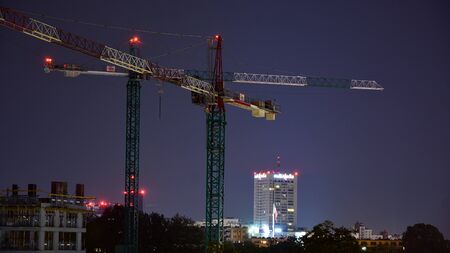 Warsaw, Poland. 30 August 2019. Construction of the Artystyczny Zoliborz stage two at night. This is a modern housing estate.のeditorial素材