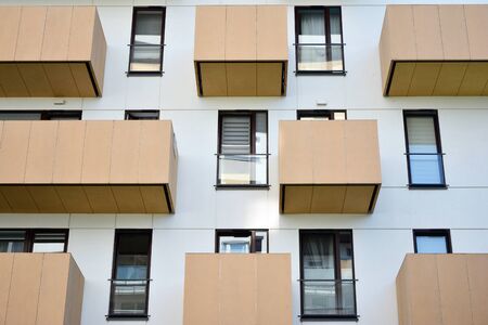 Modern apartment buildings on a sunny day with a blue sky. Facade of a modern apartment buildingの写真素材