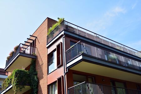 Modern apartment buildings on a sunny day with a blue sky. Facade of a modern apartment building