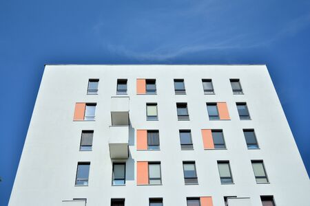Modern apartment buildings on a sunny day with a blue sky. Facade of a modern apartment buildingの写真素材