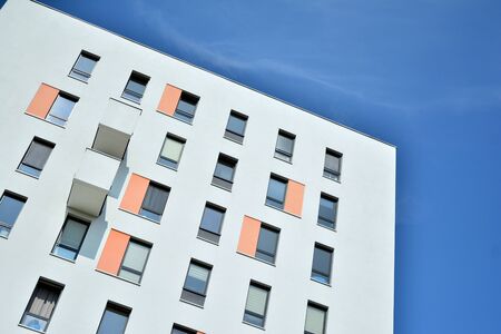 Modern apartment buildings on a sunny day with a blue sky. Facade of a modern apartment building