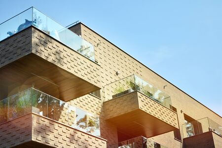 Modern apartment buildings on a sunny day with a blue sky. Facade of a modern apartment...
