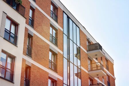 Modern apartment buildings on a sunny day with a blue sky. Facade of a modern apartment...