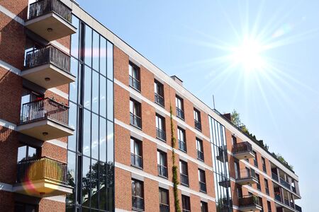 Modern apartment buildings on a sunny day with a blue sky. Facade of a modern apartment...