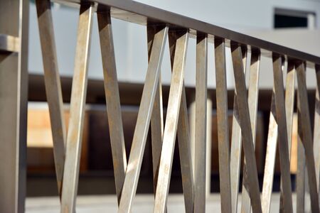 Chromium metal fence with handrail. Chrome-plated metal railings. Shallow depth of field. Selective...