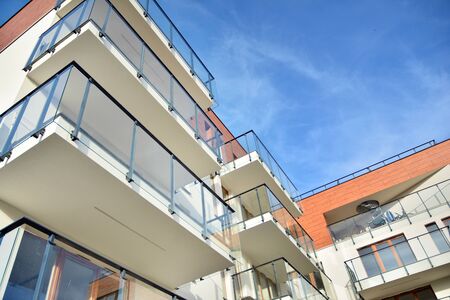 Modern apartment buildings on a sunny day with a blue sky. Facade of a modern apartment building