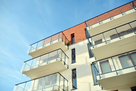 Modern apartment buildings on a sunny day with a blue sky. Facade of a modern apartment building