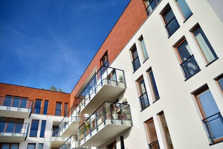Modern apartment buildings on a sunny day with a blue sky. Facade of a modern apartment building