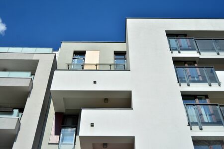 Modern apartment buildings on a sunny day with a blue sky. Facade of a modern apartment building