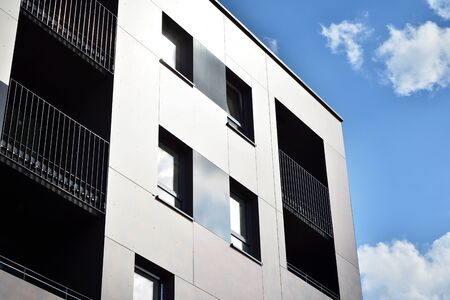 Modern apartment buildings on a sunny day with a blue sky. Facade of a modern apartment building