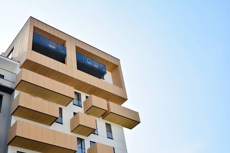 Modern apartment buildings on a sunny day with a blue sky. Facade of a modern apartment building