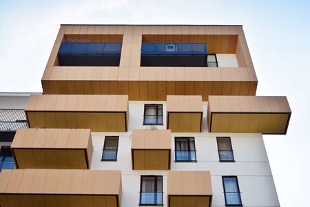 Modern apartment buildings on a sunny day with a blue sky. Facade of a modern apartment building