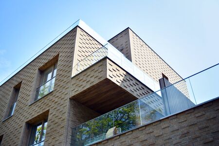 Modern apartment buildings on a sunny day with a blue sky. Facade of a modern apartment building