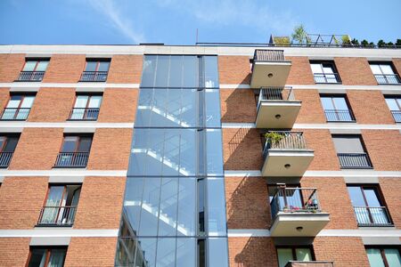 Modern apartment buildings on a sunny day with a blue sky. Facade of a modern apartment building