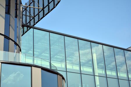 Facade fragment of a modern office building. Exterior of glass wall with abstract texture.