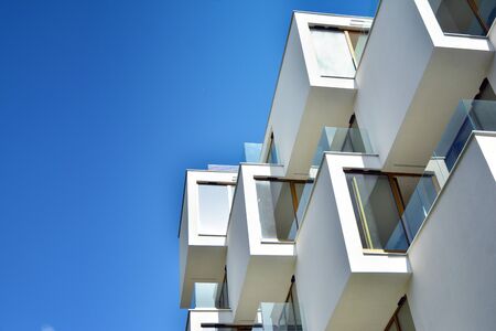 Modern apartment buildings on a sunny day with a blue sky. Facade of a modern apartment building