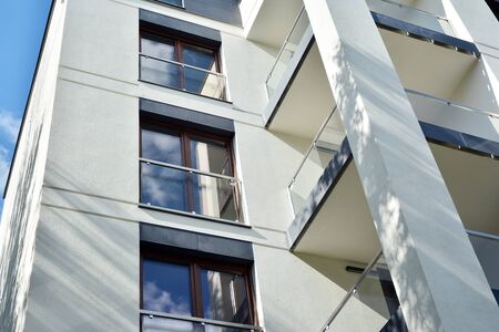 Modern apartment buildings on a sunny day with a blue sky. Facade of a modern apartment building