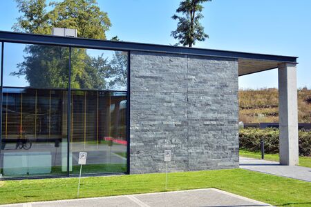 Facade fragment of a modern office building. Exterior of glass wall with abstract texture.