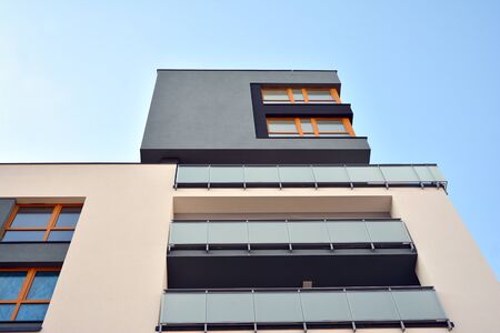 Modern luxury urban apartment building exterior with blue sky