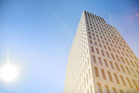 Modern office building detail. Perspective view of geometric angular concrete windows on the facade...