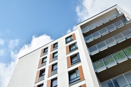 Modern luxury urban apartment building exterior with blue sky